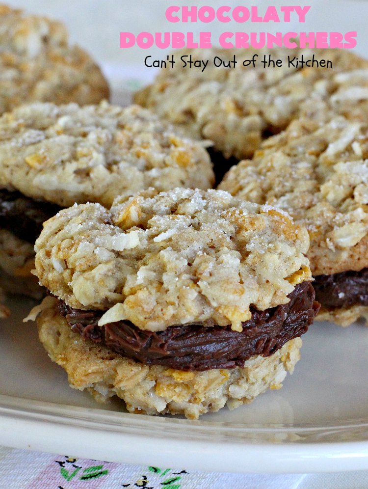 Chocolaty Double Crunchers | Can't Stay Out of the Kitchen | this scrumptious #cookie #recipe is to die for! The cookies contain #oatmeal, #CornFlakes & #coconut. The #chocolate frosting is made from #ChocolateChips & #CreamCheese. Absolutely mouthwatering #dessert for #tailgating, potlucks or #ChristmasCookieExchanges. #ChocolateDessert #WhoopiePie #OatmealWhoopiePie#ChocolatyDoubleCrunchers #SandwichCookie #OatmealSandwichCookie