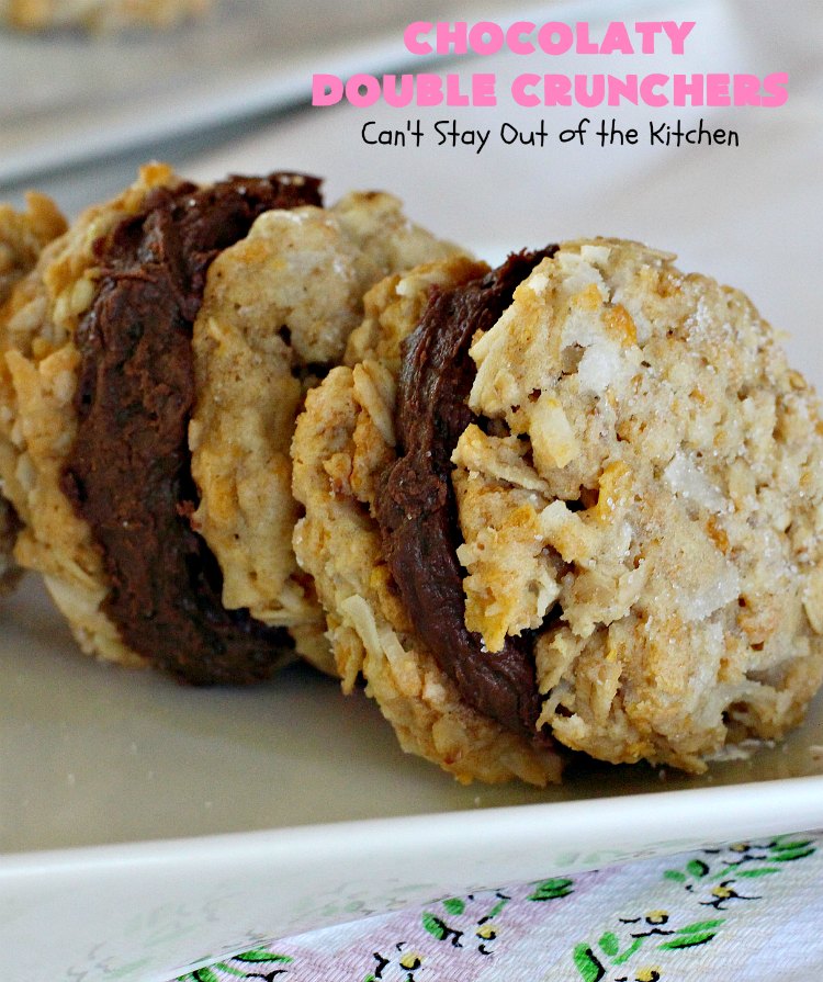 Chocolaty Double Crunchers | Can't Stay Out of the Kitchen | this scrumptious #cookie #recipe is to die for! The cookies contain #oatmeal, #CornFlakes & #coconut. The #chocolate frosting is made from #ChocolateChips & #CreamCheese. Absolutely mouthwatering #dessert for #tailgating, potlucks or #ChristmasCookieExchanges. #ChocolateDessert #WhoopiePie #OatmealWhoopiePie#ChocolatyDoubleCrunchers #SandwichCookie #OatmealSandwichCookie