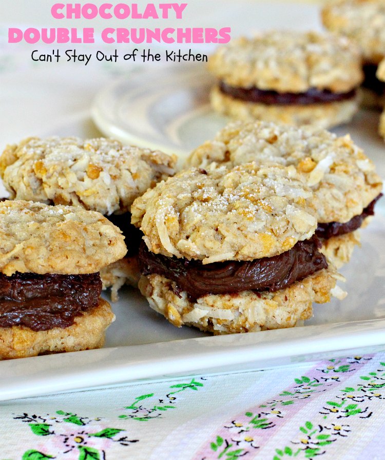 Chocolaty Double Crunchers | Can't Stay Out of the Kitchen | this scrumptious #cookie #recipe is to die for! The cookies contain #oatmeal, #CornFlakes & #coconut. The #chocolate frosting is made from #ChocolateChips & #CreamCheese. Absolutely mouthwatering #dessert for #tailgating, potlucks or #ChristmasCookieExchanges. #ChocolateDessert #WhoopiePie #OatmealWhoopiePie#ChocolatyDoubleCrunchers #SandwichCookie #OatmealSandwichCookie