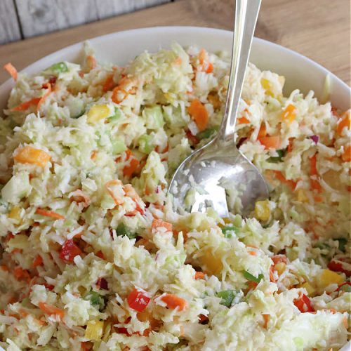 Confetti Cole Slaw | Can't Stay Out of the Kitchen | this is one of the BEST #ColeSlaw #recipes I've ever had! This one includes #cabbage, #carrots #pineapple, #celery & four kinds of #BellPeppers. The colors remind you of #confetti! And the flavor is irresistible with the sweet #ColeSlawDressing the #salad is paired with. Great for potlucks, summer #holiday fare or backyard BBQs. #ConfettiColeSlaw #GlutenFree