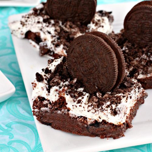 Cookies 'n Creme Brownies | Can't Stay Out of the Kitchen | these heavenly #brownies are rich, decadent & divine! The #brownie layer includes Oreos & vanilla buttercream frosting. Plus there's more frosting on top plus #Oreos. You'll be drooling after the first bite! #Chocolate #ChocolateDessert #OreoDessert #dessert #recipe #5IngredientRecipe #EasyChocolateDessert #EasyOreoDessert #ValentinesDay #ValentinesDayDessert