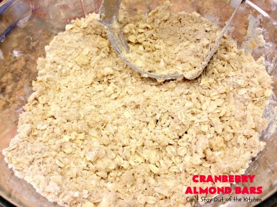 Paula Deen's Cranberry Almond Bars | Can't Stay Out of the Kitchen | fabulous #PaulaDeen #cookie recipe with a streusel crust and topping. The filling is made with fresh #cranberries & #pineapple preserves & #almonds on top. This is a terrific #dessert for #Christmas baking.