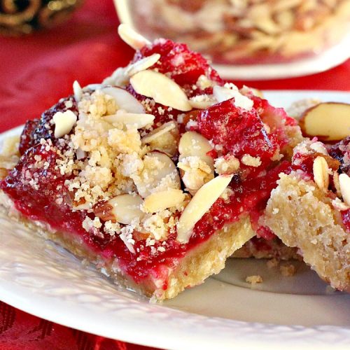 Paula Deen's Cranberry Almond Bars | Can't Stay Out of the Kitchen | fabulous #PaulaDeen #cookie recipe with a streusel crust and topping. The filling is made with fresh #cranberries & #pineapple preserves & #almonds on top. This is a terrific #dessert for #Christmas baking.