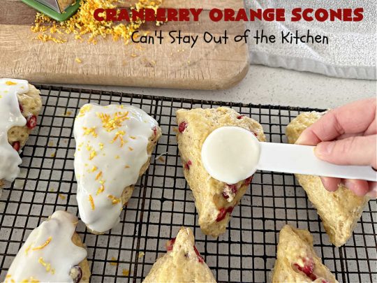 Cranberry Orange Scones | Can't Stay Out of the Kitchen | these luscious #scones have the most spectacular combination of flavors using fresh #cranberries, #OrangeZest & featuring a luscious #orange icing with more Orange Zest on top. They simply beg to be eaten! You'll be swooning after sinking your teeth into these amazing #CranberryOrangeScones. Great for a weekend, company or #holiday #breakfast or #brunch like #Thanksgiving, #Christmas, #NewYearsDay or #ValentinesDay.