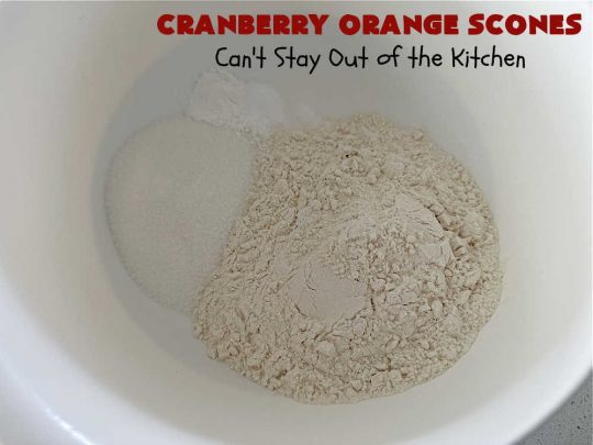 Cranberry Orange Scones | Can't Stay Out of the Kitchen | these luscious #scones have the most spectacular combination of flavors using fresh #cranberries, #OrangeZest & featuring a luscious #orange icing with more Orange Zest on top. They simply beg to be eaten! You'll be swooning after sinking your teeth into these amazing #CranberryOrangeScones. Great for a weekend, company or #holiday #breakfast or #brunch like #Thanksgiving, #Christmas, #NewYearsDay or #ValentinesDay.