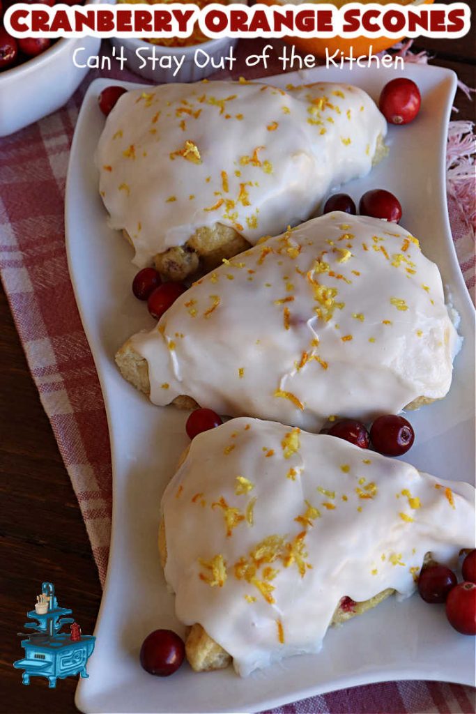 Cranberry Orange Scones | Can't Stay Out of the Kitchen | these luscious #scones have the most spectacular combination of flavors using fresh #cranberries, #OrangeZest & featuring a luscious #orange icing with more Orange Zest on top. They simply beg to be eaten! You'll be swooning after sinking your teeth into these amazing #CranberryOrangeScones. Great for a weekend, company or #holiday #breakfast or #brunch like #Thanksgiving, #Christmas, #NewYearsDay or #ValentinesDay.