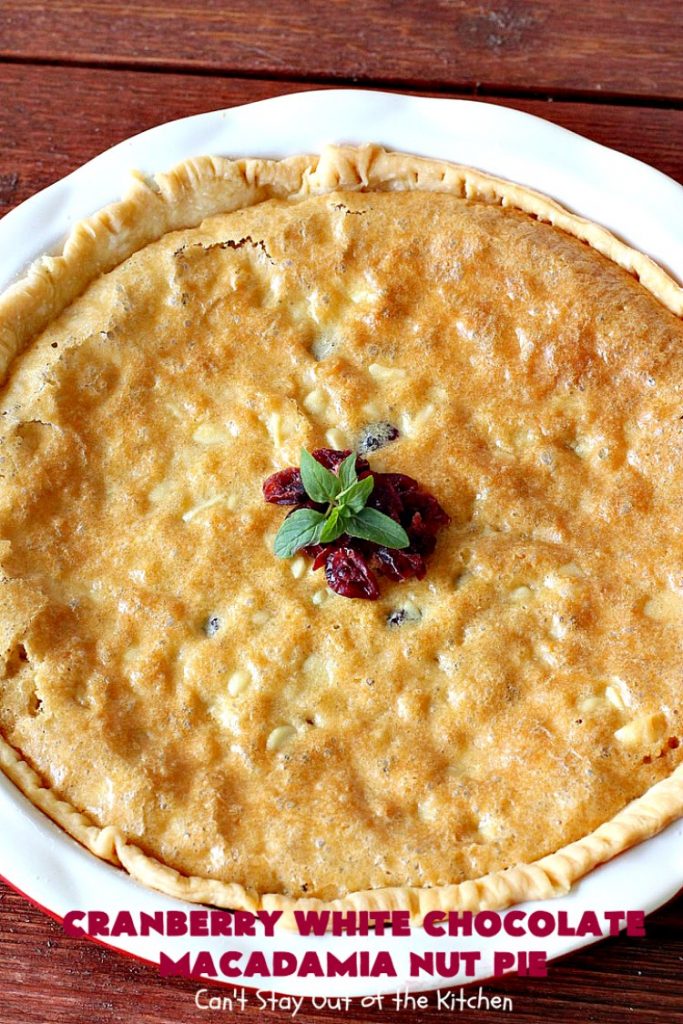 Cranberry White Chocolate Macadamia Nut Pie | Can't Stay Out of the Kitchen | this irresistible #pie is made with dried #cranberries, #MacadamiaNuts & #WhiteChocolateChips. It's so rich & decadent you'll be hooked from your first bite. Wonderful for #holiday parties and #Christmas dinner menus. #chocolate #dessert #Craisins #HolidayDessert #ChocolateDessert #CranberryDessert #CranberryWhiteChocolateMacadamiaNutPie