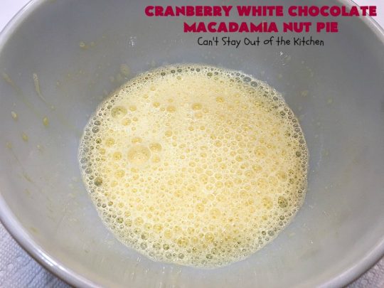 Cranberry White Chocolate Macadamia Nut Pie | Can't Stay Out of the Kitchen | this irresistible #pie is made with dried #cranberries, #MacadamiaNuts & #WhiteChocolateChips. It's so rich & decadent you'll be hooked from your first bite. Wonderful for #holiday parties and #Christmas dinner menus. #chocolate #dessert #Craisins #HolidayDessert #ChocolateDessert #CranberryDessert #CranberryWhiteChocolateMacadamiaNutPie