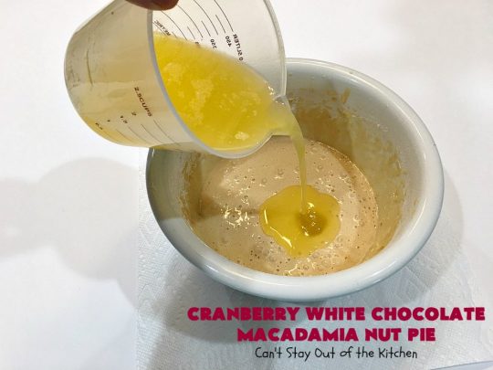 Cranberry White Chocolate Macadamia Nut Pie | Can't Stay Out of the Kitchen | this irresistible #pie is made with dried #cranberries, #MacadamiaNuts & #WhiteChocolateChips. It's so rich & decadent you'll be hooked from your first bite. Wonderful for #holiday parties and #Christmas dinner menus. #chocolate #dessert #Craisins #HolidayDessert #ChocolateDessert #CranberryDessert #CranberryWhiteChocolateMacadamiaNutPie