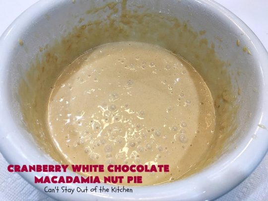 Cranberry White Chocolate Macadamia Nut Pie | Can't Stay Out of the Kitchen | this irresistible #pie is made with dried #cranberries, #MacadamiaNuts & #WhiteChocolateChips. It's so rich & decadent you'll be hooked from your first bite. Wonderful for #holiday parties and #Christmas dinner menus. #chocolate #dessert #Craisins #HolidayDessert #ChocolateDessert #CranberryDessert #CranberryWhiteChocolateMacadamiaNutPie