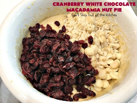 Cranberry White Chocolate Macadamia Nut Pie | Can't Stay Out of the Kitchen | this irresistible #pie is made with dried #cranberries, #MacadamiaNuts & #WhiteChocolateChips. It's so rich & decadent you'll be hooked from your first bite. Wonderful for #holiday parties and #Christmas dinner menus. #chocolate #dessert #Craisins #HolidayDessert #ChocolateDessert #CranberryDessert #CranberryWhiteChocolateMacadamiaNutPie