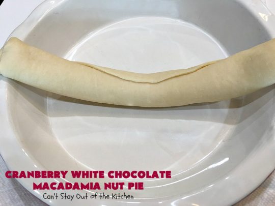 Cranberry White Chocolate Macadamia Nut Pie | Can't Stay Out of the Kitchen | this irresistible #pie is made with dried #cranberries, #MacadamiaNuts & #WhiteChocolateChips. It's so rich & decadent you'll be hooked from your first bite. Wonderful for #holiday parties and #Christmas dinner menus. #chocolate #dessert #Craisins #HolidayDessert #ChocolateDessert #CranberryDessert #CranberryWhiteChocolateMacadamiaNutPie