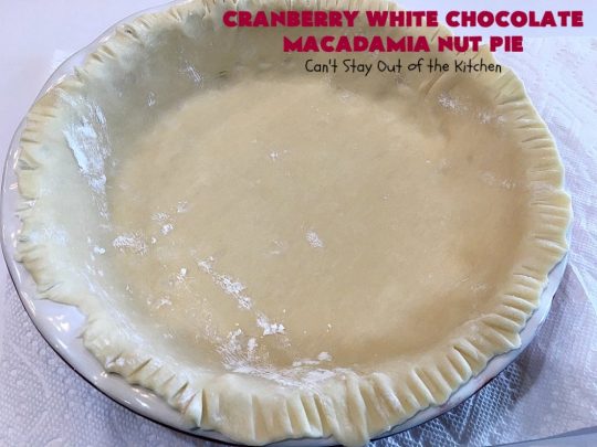 Cranberry White Chocolate Macadamia Nut Pie | Can't Stay Out of the Kitchen | this irresistible #pie is made with dried #cranberries, #MacadamiaNuts & #WhiteChocolateChips. It's so rich & decadent you'll be hooked from your first bite. Wonderful for #holiday parties and #Christmas dinner menus. #chocolate #dessert #Craisins #HolidayDessert #ChocolateDessert #CranberryDessert #CranberryWhiteChocolateMacadamiaNutPie