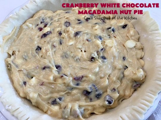 Cranberry White Chocolate Macadamia Nut Pie | Can't Stay Out of the Kitchen | this irresistible #pie is made with dried #cranberries, #MacadamiaNuts & #WhiteChocolateChips. It's so rich & decadent you'll be hooked from your first bite. Wonderful for #holiday parties and #Christmas dinner menus. #chocolate #dessert #Craisins #HolidayDessert #ChocolateDessert #CranberryDessert #CranberryWhiteChocolateMacadamiaNutPie