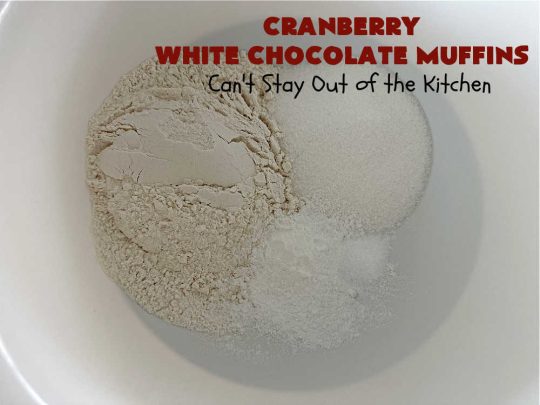 Cranberry White Chocolate Muffins | Can't Stay Out of the Kitchen | These fantastic #muffins are just what the doctor orders for a sweet tooth craving! They're filled with real #WhiteChocolateChips & #DriedCranberries. #Applesauce & #bananas also add sweetness. Excellent option for any #breakfast or #brunch menu, or for #tailgating parties or #potlucks. #cranberries #chocolate #CranberryWhiteChocolateMuffins