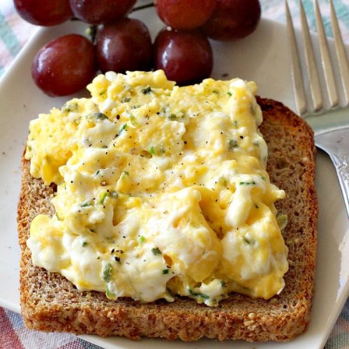 Creamy Scrambled Eggs with Chives | Can't Stay Out of the Kitchen | this outstanding #GooseberryPatch #recipe is marvelous for a weekend, company or #holiday #breakfast. #ScrambledEggs are filled with #CreamCheese & chives. Then served over toast. These creamy #eggs are easy to prepare & so delicious. #brunch #HolidayBreakfast #CreamyScrambledEggsWithChives