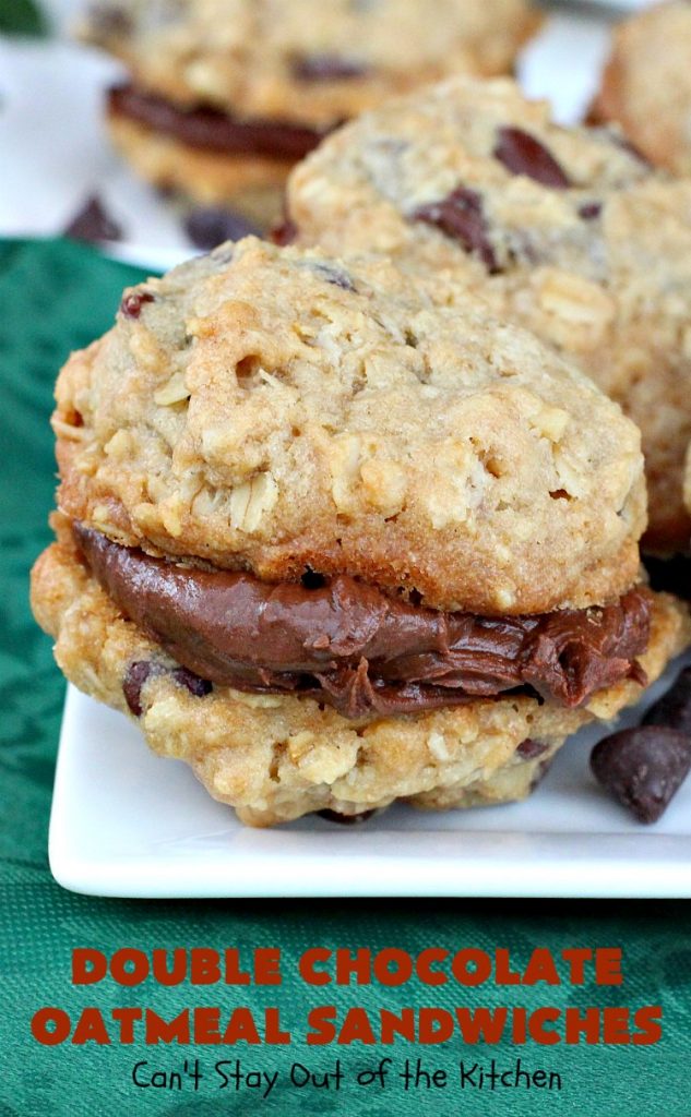 Double Chocolate Oatmeal Cookies | Can't Stay Out of the Kitchen | these spectacular #OatmealCookies feature #ChocolateChips in the #cookies and a #chocolate #fudge frosting sandwiched between to die for! Amazing #dessert for #holiday #ChristmasCookie baking. #ChristmasCookieExchange #FallBaking #DoubleChocolateOatmealSandwiches #ChocolateFudgeFrosting #HolidayDessert