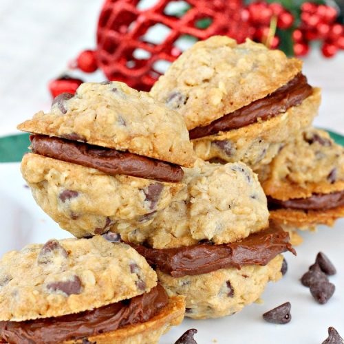 Double Chocolate Oatmeal Cookies | Can't Stay Out of the Kitchen | these spectacular #OatmealCookies feature #ChocolateChips in the #cookies and a #chocolate #fudge frosting sandwiched between to die for! Amazing #dessert for #holiday #ChristmasCookie baking. #ChristmasCookieExchange #FallBaking #DoubleChocolateOatmealSandwiches #ChocolateFudgeFrosting #HolidayDessert