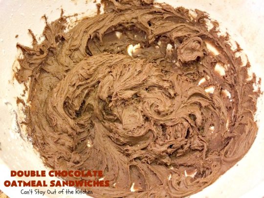 Double Chocolate Oatmeal Cookies | Can't Stay Out of the Kitchen | these spectacular #OatmealCookies feature #ChocolateChips in the #cookies and a #chocolate #fudge frosting sandwiched between to die for! Amazing #dessert for #holiday #ChristmasCookie baking. #ChristmasCookieExchange #FallBaking #DoubleChocolateOatmealSandwiches #ChocolateFudgeFrosting #HolidayDessert