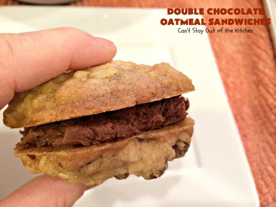 Double Chocolate Oatmeal Cookies | Can't Stay Out of the Kitchen | these spectacular #OatmealCookies feature #ChocolateChips in the #cookies and a #chocolate #fudge frosting sandwiched between to die for! Amazing #dessert for #holiday #ChristmasCookie baking. #ChristmasCookieExchange #FallBaking #DoubleChocolateOatmealSandwiches #ChocolateFudgeFrosting #HolidayDessert