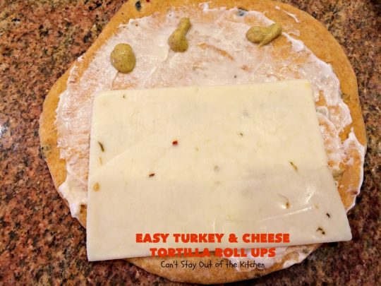 Easy Turkey and Cheese Tortilla Roll Ups | Can't Stay Out of the Kitchen | these fantastic wraps make a terrific treat for #tailgating parties, potlucks or soccer games. Easy & delicious. #sandwiches #cheese #TurkeySandwiches #TurkeyWraps #TurkeyRollUps #PepperJackCheese #SwissCheese #CheddarCheese