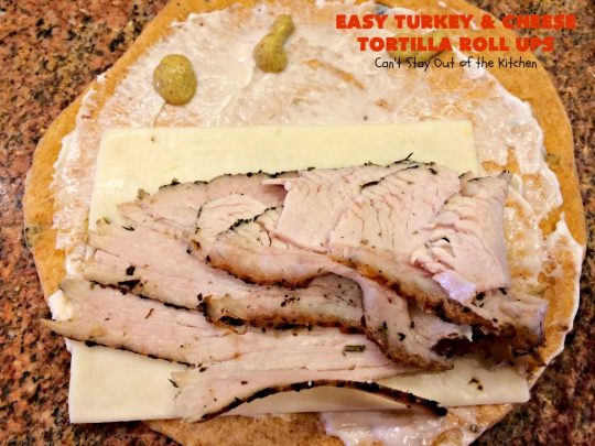 Easy Turkey and Cheese Tortilla Roll Ups | Can't Stay Out of the Kitchen | these fantastic wraps make a terrific treat for #tailgating parties, potlucks or soccer games. Easy & delicious. #sandwiches #cheese #TurkeySandwiches #TurkeyWraps #TurkeyRollUps #PepperJackCheese #SwissCheese #CheddarCheese