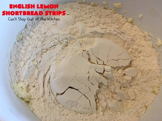 English Lemon Shortbread Strips | Can't Stay Out of the Kitchen | these amazing #lemon bars have a lemony icing to die for. They're terrific for #holiday parties, #Christmas #cookie exchanges or #tailgating. #dessert