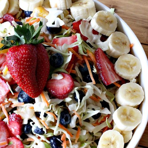 Fruit Cole Slaw | Can't Stay Out of the Kitchen | try this revved up version of #ColeSlaw for your next #holiday potluck. Perfect for #MothersDay, #MemorialDay, #FathersDay, #FourthofJuly & #LaborDay. This one includes #Strawberries #Blueberries, #Bananas & #FruitCocktail. #Salad #FruitColeSlaw #GlutenFree #Healthy #LowCalorie #CleanEating