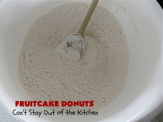 Fruitcake Donuts | Can't Stay Out of the Kitchen | #FruitcakeDonuts are divine! These heavenly #donuts are filled with #fruitcake mix & laced with #AlmondExtract which greatly increases the flavor. #Almond icing & #RainbowSprinkles amp up the flavors even more! Perfect for #Thanksgiving or #Christmas #breakfast or #brunch. #CandiedCherries #CandiedPineapple #ParadiseFruit #HolidayBreakfast #holiday