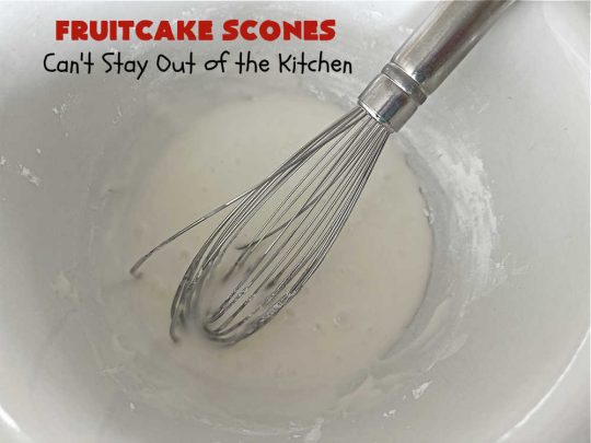 Fruitcake Scones | Can't Stay Out of the Kitchen | these #FruitcakeScones are to die for! Truly, these #scones are filled with #FruitcakeMix & laced with #AlmondExtract in the scone and the icing. Perfect for #breakfast or #brunch menus during #Thanksgiving week or #Christmas week. You'll be drooling over every bite! #holiday #HolidayBreakfast #HolidayBaking #fruitcake #cherries #ParadiseFruit