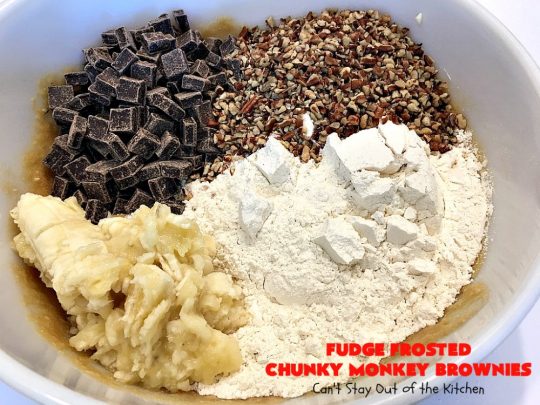 Fudge Frosted Chunky Monkey Brownies | Can't Stay Out of the Kitchen | These heavenly #brownies have #chocolate chunks in the batter & #fudge frosting on top. This addictive #dessert has triple the chocolate threat when you add ice cream & #Ghirardelli chocolate sauce on top!