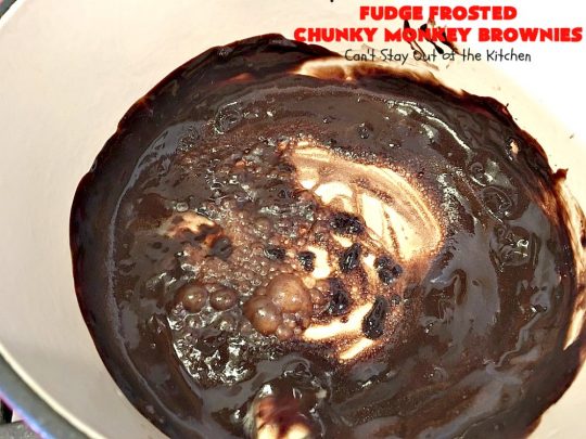 Fudge Frosted Chunky Monkey Brownies | Can't Stay Out of the Kitchen | These heavenly #brownies have #chocolate chunks in the batter & #fudge frosting on top. This addictive #dessert has triple the chocolate threat when you add ice cream & #Ghirardelli chocolate sauce on top!