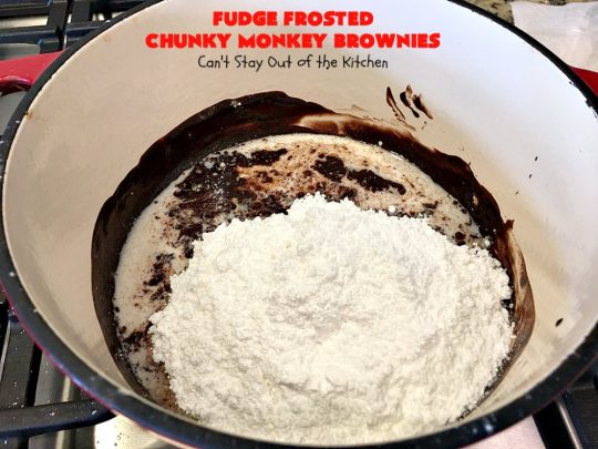 Fudge Frosted Chunky Monkey Brownies | Can't Stay Out of the Kitchen | These heavenly #brownies have #chocolate chunks in the batter & #fudge frosting on top. This addictive #dessert has triple the chocolate threat when you add ice cream & #Ghirardelli chocolate sauce on top!