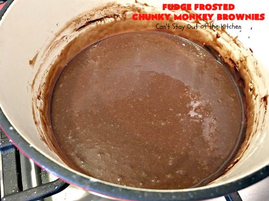Fudge Frosted Chunky Monkey Brownies | Can't Stay Out of the Kitchen | These heavenly #brownies have #chocolate chunks in the batter & #fudge frosting on top. This addictive #dessert has triple the chocolate threat when you add ice cream & #Ghirardelli chocolate sauce on top!