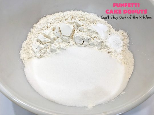 Funfetti Cake Donuts | Can't Stay Out of the Kitchen | my favorite #donut #recipe. These have delightful #almond flavoring in the donut & icing. #Sprinkles make everything better! Great for a #holiday #breakfast like #MemorialDay or #FathersDay. #Funfetti #FunfettiCakeDonuts #HolidayBreakfast