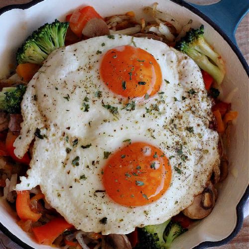 Garden Vegetable Breakfast Skillet | Can't Stay Out of the Kitchen | this delectable #BreakfastSkillet includes seasoned #HashBrowns, #MontereyJack & #CheddarCheese, several garden #vegetables including #mushrooms & #broccoli & it's topped with two #eggs. It's a fantastic hearty #breakfast for weekends, company or #holidays. #vegetarian #GlutenFree #VegetarianBreakfastSkillet #GardenVegetableBreakfastSkillet #HolidayBreakfast