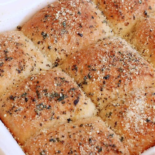 Garlic Parmesan Dinner Rolls | Can't Stay Out of the Kitchen | these #DinnerRolls are fantastic! They're easy to whip up since they're no-knead #rolls. #NoKneading #NoMixing! They're made in the #breadmaker. The rolls are glazed with a #garlic #parmesan #herb butter sauce and are totally mouthwatering. Great for #holidays, company dinners & especially any time you serve #pasta. Everyone will want seconds! #bread #GarlicParmesanDinnerRolls