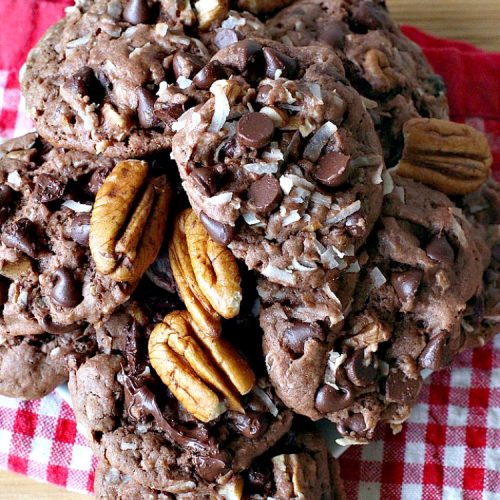 German Chocolate Cookies | Can't Stay Out of the Kitchen | these luscious #cookies use only 6 ingredients since they start with a #CakeMix. If you enjoy #GermanChocolateCake this #dessert is for you! #coconut #pecans #chocolate #GermanChocolateCookies #ChocolateChips #tailgating #holiday #ChristmasCookieExchange #HolidayBaking