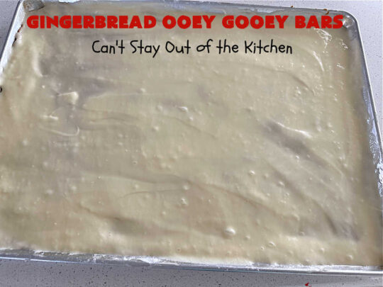 Gingerbread Ooey Gooey Bars | Can't Stay Out of the Kitchen | these delicious bar-type #cookies have all the classic flavors of #OoeyGooeyBars but with a #Gingerbread flavor instead! A #GingerbreadCakeMix is used for the crust layer. It's topped with a #CheeseCake layer, #WhiteChocolateChips & sprinkled with #PowderedSugar. Every bite will knock your socks off! Great for #Christmas or #holiday parties, #tailgating or a #ChristmasCookieExchange. #dessert #GingerbreadDessert #GingerbreadOoeyGooeyBars