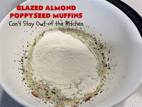 Glazed Almond Poppyseed Muffins | Can't Stay Out of the Kitchen | these fantastic #muffins just pop with #almond flavor. They're delightful to serve for a family, company or #holiday #breakfast. Every bite will have you swooning. #poppyseeds #GlazedAlmondPoppyseedMuffins