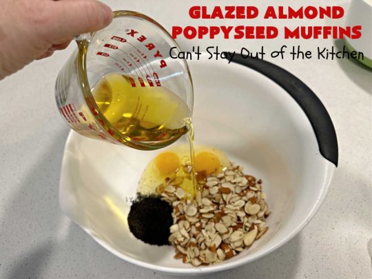 Glazed Almond Poppyseed Muffins | Can't Stay Out of the Kitchen | these fantastic #muffins just pop with #almond flavor. They're delightful to serve for a family, company or #holiday #breakfast. Every bite will have you swooning. #poppyseeds #GlazedAlmondPoppyseedMuffins