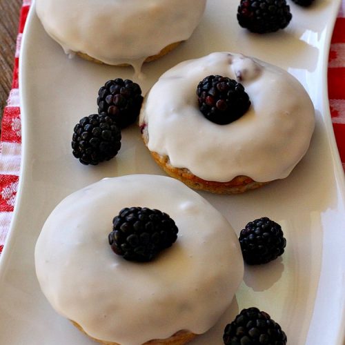 Glazed Blackberry Donuts | Can't Stay Out of the Kitchen | these #donuts are absolutely heavenly. They're filled with #blackberries & glazed with a luscious vanilla glaze. Perfect for a #holiday, company or weekend #breakfast. #HolidayBreakfast #BlackberryDonuts #BakedDonuts
