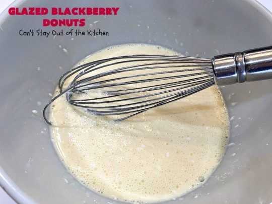 Glazed Blackberry Donuts | Can't Stay Out of the Kitchen | these #donuts are absolutely heavenly. They're filled with #blackberries & glazed with a luscious vanilla glaze. Perfect for a #holiday, company or weekend #breakfast. #HolidayBreakfast #BlackberryDonuts #BakedDonuts