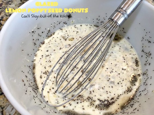 Glazed Lemon Poppyseed Donuts | Can't Stay Out of the Kitchen | these #donuts are awesome! They have #lemon juice & lemon zest in both the donut and icing. Terrific for a weekend or #holiday #breakfast. #poppyseeds #HolidayBreakfast #LemonPoppyseedDonuts #HomemadeDonuts