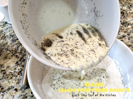 Glazed Lemon Poppyseed Donuts | Can't Stay Out of the Kitchen | these #donuts are awesome! They have #lemon juice & lemon zest in both the donut and icing. Terrific for a weekend or #holiday #breakfast. #poppyseeds #HolidayBreakfast #LemonPoppyseedDonuts #HomemadeDonuts