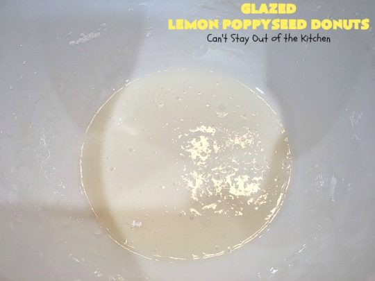 Glazed Lemon Poppyseed Donuts | Can't Stay Out of the Kitchen | these #donuts are awesome! They have #lemon juice & lemon zest in both the donut and icing. Terrific for a weekend or #holiday #breakfast. #poppyseeds #HolidayBreakfast #LemonPoppyseedDonuts #HomemadeDonuts