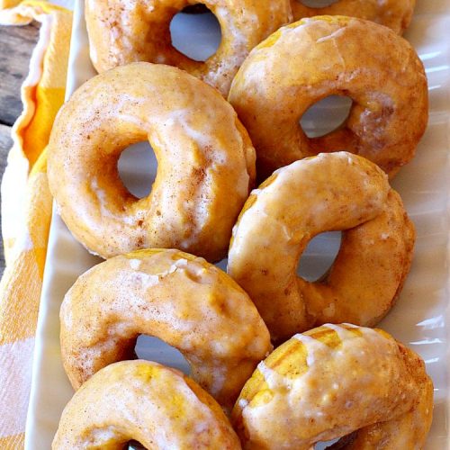 Glazed Pumpkin Donuts | Can't Stay Out of the Kitchen | These #donuts will knock your socks off! They're filled with #pumpkin & pumpkin pie spice. Then they're glazed with vanilla icing & sprinkled with #cinnamon. Terrific for #fall & winter #baking, #holidays & company. #PumpkinDonuts #Breakfast #HolidayBreakfast #NewYearsDay #NewYearsDayBreakfast