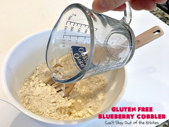 Gluten Free Blueberry Cobbler | Can't Stay Out of the Kitchen | this fantastic #cobbler is perfect for #holiday menus like #MothersDay or #FathersDay. It's filled with fresh #blueberries & has a delightful #glutenfree topping. Then it's served with warm blueberry sauce & ice cream! You'll never believe this decadent #dessert doesn't have regular flour! #BlueberryCobbler 