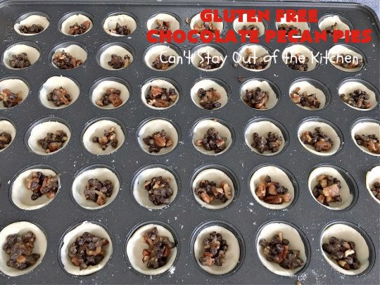 Gluten Free Chocolate Pecan Pies | Can't Stay Out of the Kitchen | these miniature #PecanPies are outstanding! They include miniature #chocolate chips to increase flavor & deliciousness. These fabulous #cookies can be made with #GlutenFree flour or regular flour--depending on your needs. Every bite will rock your world. Enjoy at #tailgating parties, potlucks or even #holiday #baking. #Christmas #PecanDessert #ChocolateDessert #GlutenFreeChocolatePecanPies