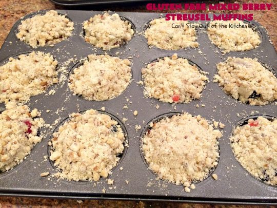 Gluten Free Mixed Berry Streusel Muffins | Can't Stay Out of the Kitchen | these fantastic #muffins are filled with #blueberries, #raspberries, #blackberries & #strawberries. They're topped with a delicious #walnut streusel & iced with a vanilla glaze. They make up one mouthwatering #muffin for a weekend, company or #holiday #breakfast. #GlutenFree #GlutenFreeMuffins #GlutenFreeMixedBerryStreuselMuffins